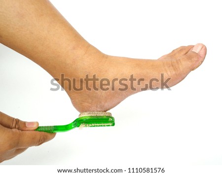 An action of foot scrub,white background