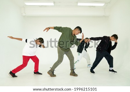 Action group of dancing class in white room studio with trainer and childen , beat box concept 