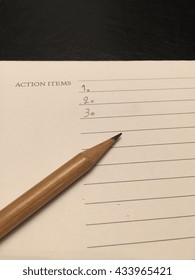 Action Items Write Down On Notebook By Pencil Put On Black Leather Table