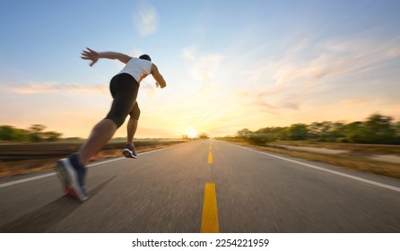 Action motion blur of a man running on country road with sunrise background.

 - Powered by Shutterstock