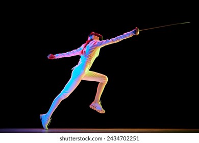 Action and motion. The dynamic motion of an athlete captured in a high-speed photograph. Female fencer training on black background in neon. Concept of professional sport, competition, championship - Powered by Shutterstock