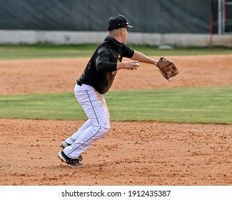 Action photo of high school baseball players making amazing plays during a baseball game - Powered by Shutterstock