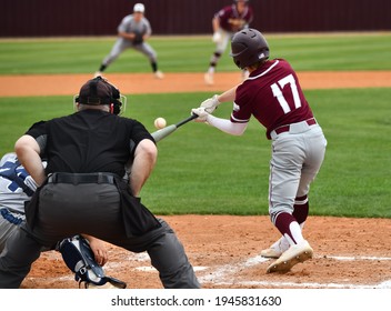 Action photo of high school baseball players making amazing plays during a baseball game - Powered by Shutterstock