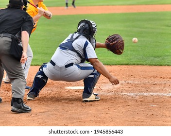 Action photo of high school baseball players making amazing plays during a baseball game