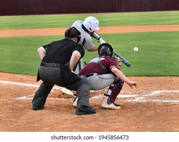 Action Photo Of High School Baseball Players Making Amazing Plays During A Baseball Game
