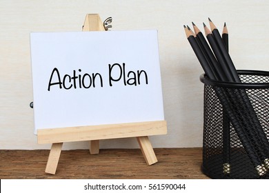 Action Plan - business concept. text at canvas with wood stand and pen on wooden table - Powered by Shutterstock