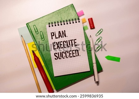 Action Plan Plan, Execute, Succed writing on notebook. Notebook on desk with coffee cup and a pen.