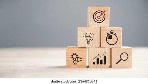 Action Plan, Goal, and Target icons on a wooden block cude step. Success and business target concept. Project management and company strategy symbolize progress. - Shutterstock ID 2364910341