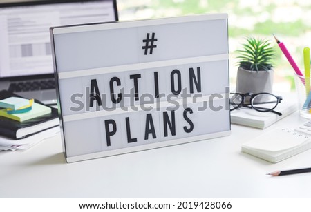 Action plan text on light box on desk table in office.Business motivation or management.