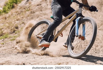 Action, sand and person on bicycle for riding, fitness and exercise outdoor with race, speed or dirt. Athlete, performance and off road mountain bike cycling for adventure, sport or workout in nature - Powered by Shutterstock