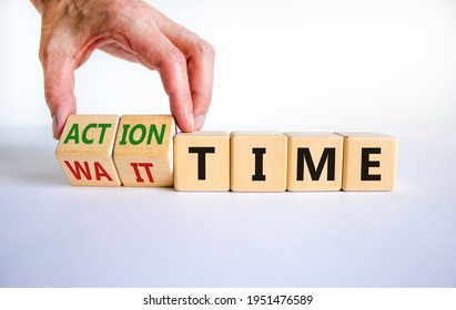 Action or wait time symbol. Businessman turns wooden cubes and changes words wait time to action time. Beautiful white background, copy space. Business and action or wait time concept.