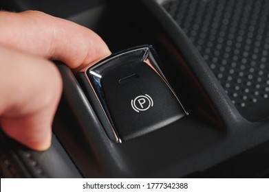 Activate Electronic Car Hand Break Button Close Up View