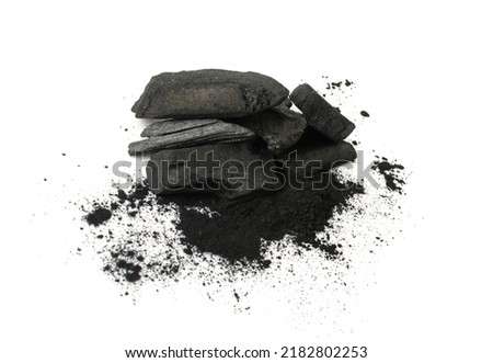 Activated carbon isolated. Active coal pile, absorbent charcoal closeup, graphite filter, absorb activated coal on white background