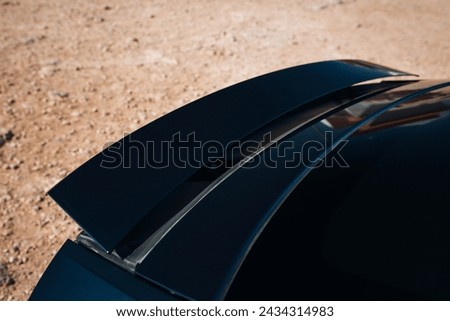 Active aerodynamic system spoiler on the trunk of modern car