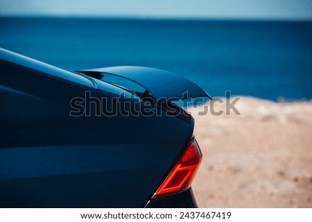 Active aerodynamic system spoiler on the trunk of modern car