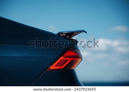 Active aerodynamic system spoiler on the trunk of modern car