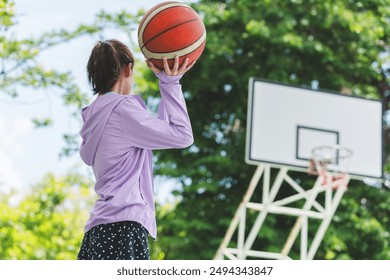 Active Asian kid girl playing basketball in the urban outdoor basketball court, Healthy life concepts
 - Powered by Shutterstock