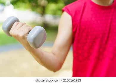 Active Asian Young Man Doing A Weightlifting By Using Dumbbell, Beginner Muscular Bodybuilder Man In Red Shirt Lift Up A Dumbell.