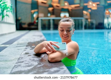 Active Athletic Fitness Diabetic Patient Monitoring Glucose Level With Remote Sensor While Training At Swimming Pool. Smart Medical Technology In Diabetes Treatment