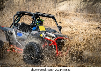 Active ATV And UTV Off-Road Vehicle In Muddy Water. ATV 4x4