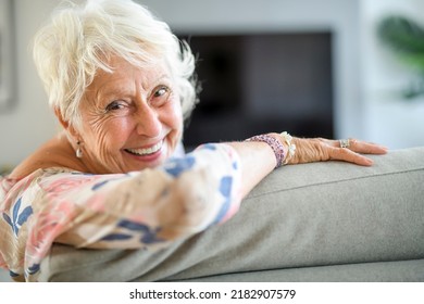 An Active Beautiful Senior Woman In The Living Room.