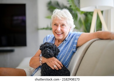 An Active Beautiful Senior Woman In The Living Room.