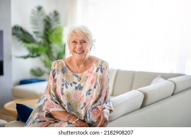 An Active beautiful senior woman in the living room. - Powered by Shutterstock