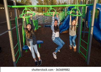 Active Children Playing Outside At School Playground