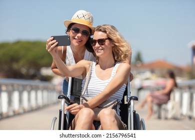 active couple taking selfie with mobile phone on the beach