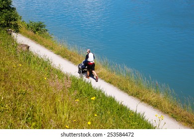 Active Dad Running, Pushing A Stroller And Listening To Music