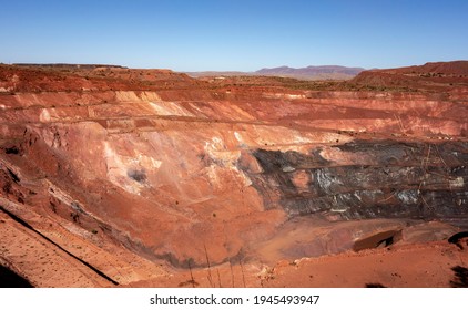 Active deep pit of red iron ore mine in Pilbara region in Western Australia