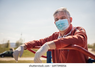 I'm Active Despite My Age. Senior Man With Mask On Face Working Exercise Outdoors.