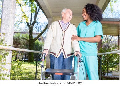 Active elderly retired man outdoor with nurse.