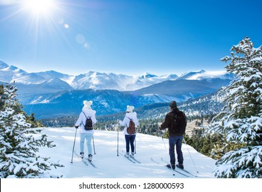 Active Family Skiing On Winter Vacation. Rocky Mountain National Park. Close To Estes Park, Colorado, USA