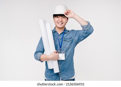 Active happy smiling asian korean young male man architect construction worker in white hardhat holding architectural plans on building isolated in white background - Powered by Shutterstock