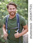 active healthy man hiking in beautiful forest