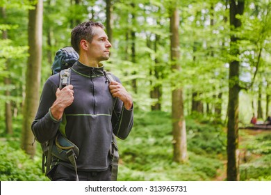 Active Healthy Man Hiking In Beautiful Forest