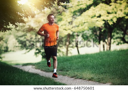 Active healthy runner jogging outdoor