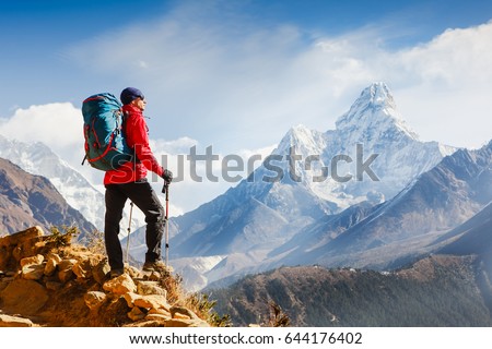 Active hiker enjoying the view. Himalayas. Nepal