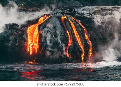Active lava flow volcanic eruption magma touching the ocean in Big Island, Kilauea volcano, Hawaii.