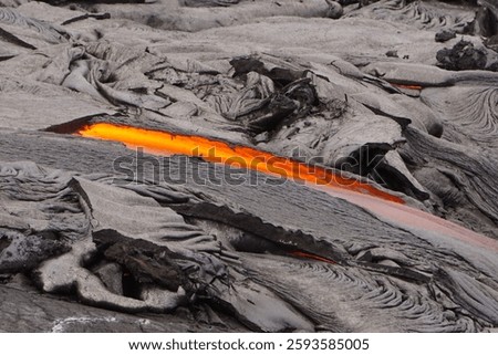 Active lava flows over old lava field after eruption of Kilauea volcano in Big island in Hawaii