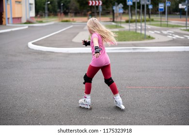 active lifestyle in a modern city - active lifestyle in a modern city - stylish girl roller-blading in a stadium
