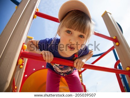 Active little girl on playground