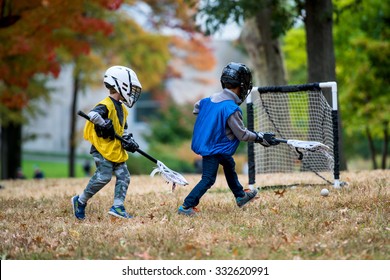 Active Little Kids Playing Lacrosse 