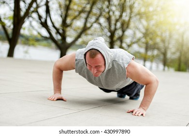 Active Man Doing Push Up In Park.