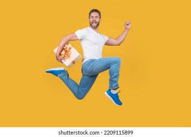 Active man running fast with gift box. Gift courier in midair. Present and gift delivery
