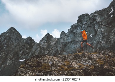 Active man trail running in rocky mountains extreme travel energy endurance concept hiking vacations adventure getaway outdoor healthy lifestyle  - Shutterstock ID 2133498249