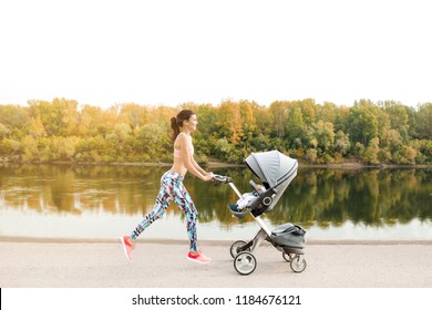 Active Mother Jogging. Jogging Or Power Walking Woman With Pram At Sunset. Mother With Child In Stroller Running