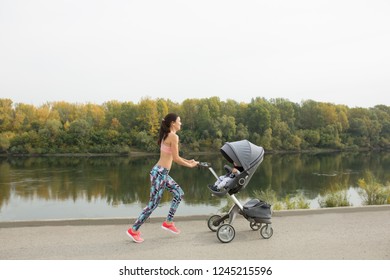 Active Mother Jogging. Jogging Or Power Walking Woman With Pram At Sunset. Mother With Child In Stroller Running