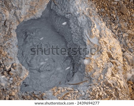 Active mud pot with rising steam on Baranovsky volcano on Iturup, Kuril islands